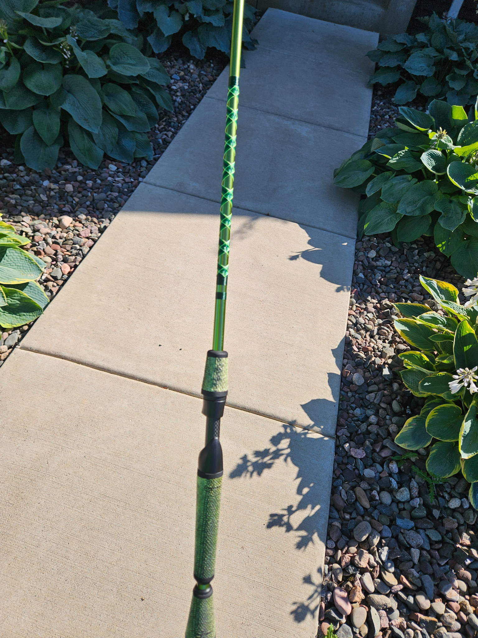 7-foot MHX Mag Bass custom rod with fish-skin grips, Fuji carbon fiber reel seat, and black American Tackle SSR guides