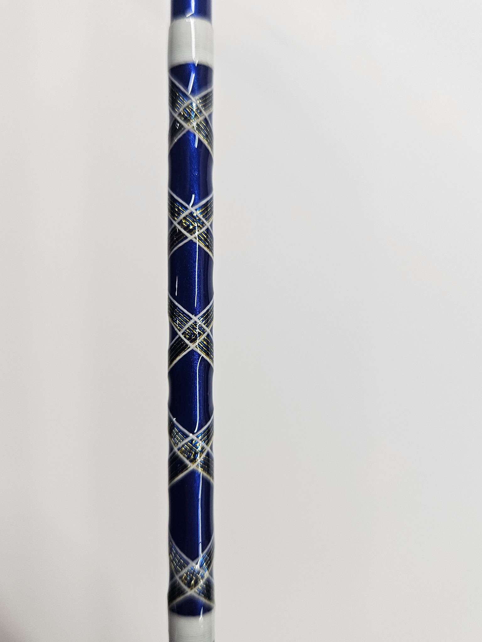 Custom rod blank with decorative thread wraps in contrasting colors