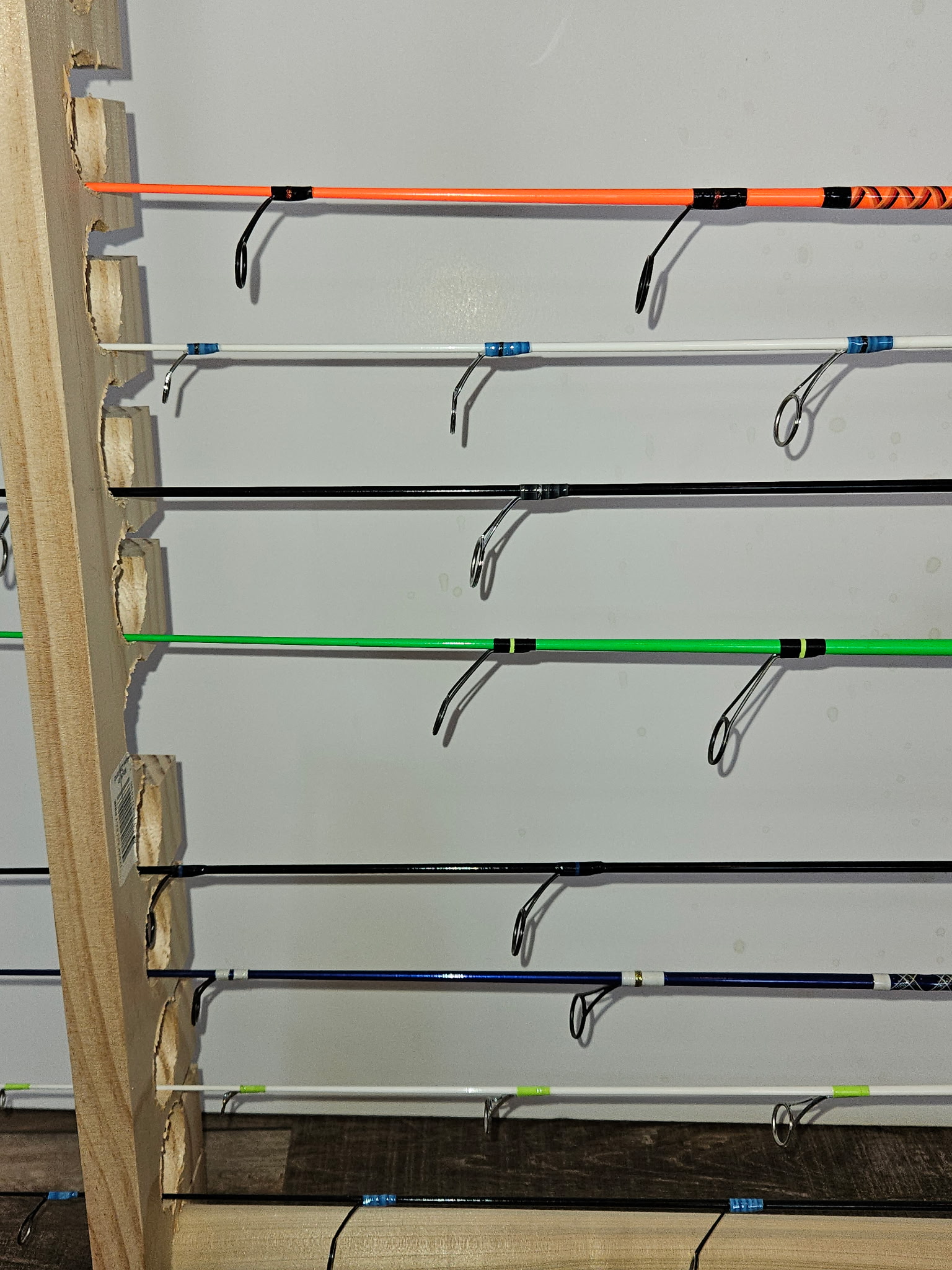 Rod building component detail — guide foot wrapped and finished with UV-cure epoxy