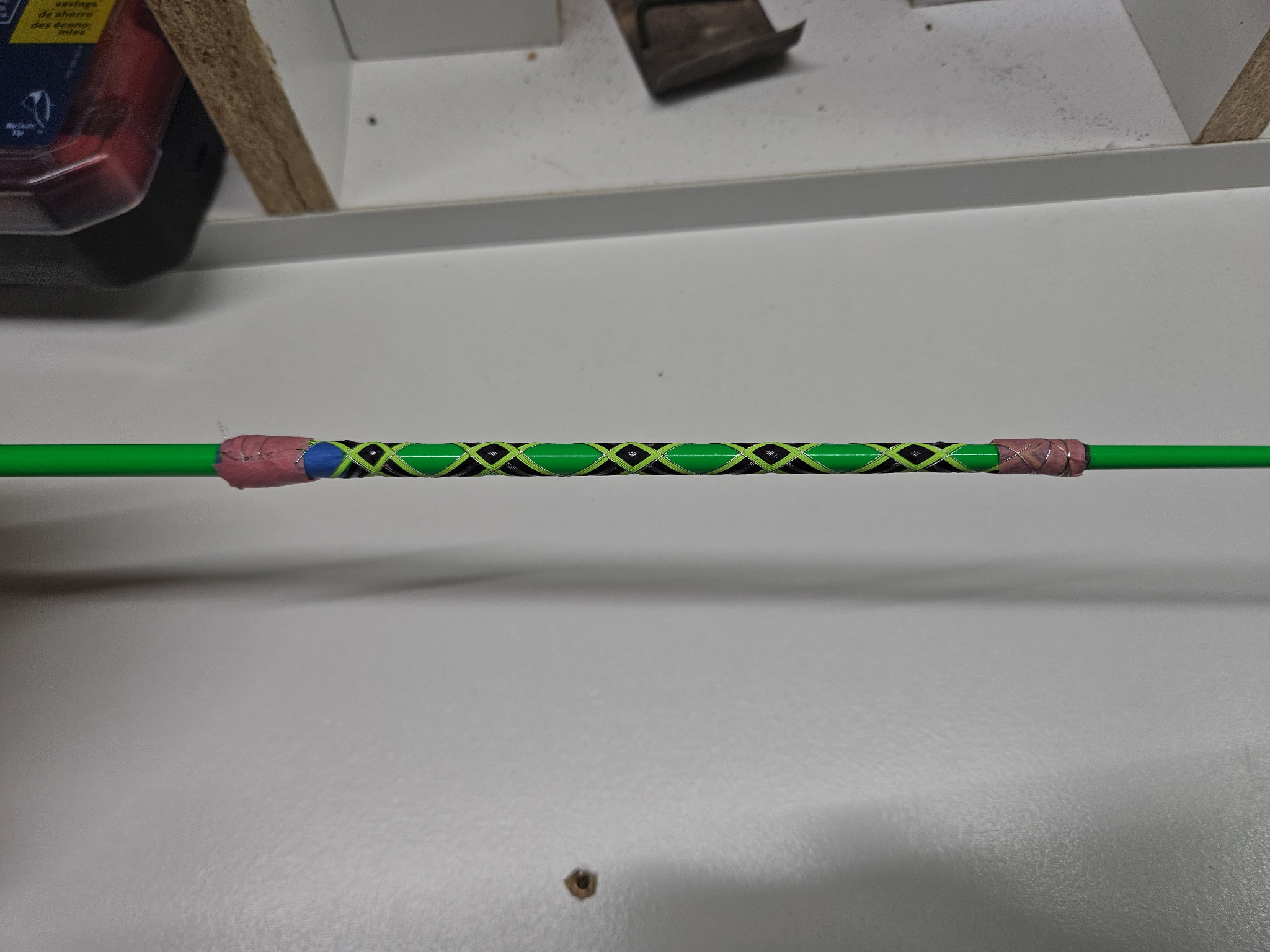 Detail shot of decorative butt wrap with multi-color thread on an OBG custom rod