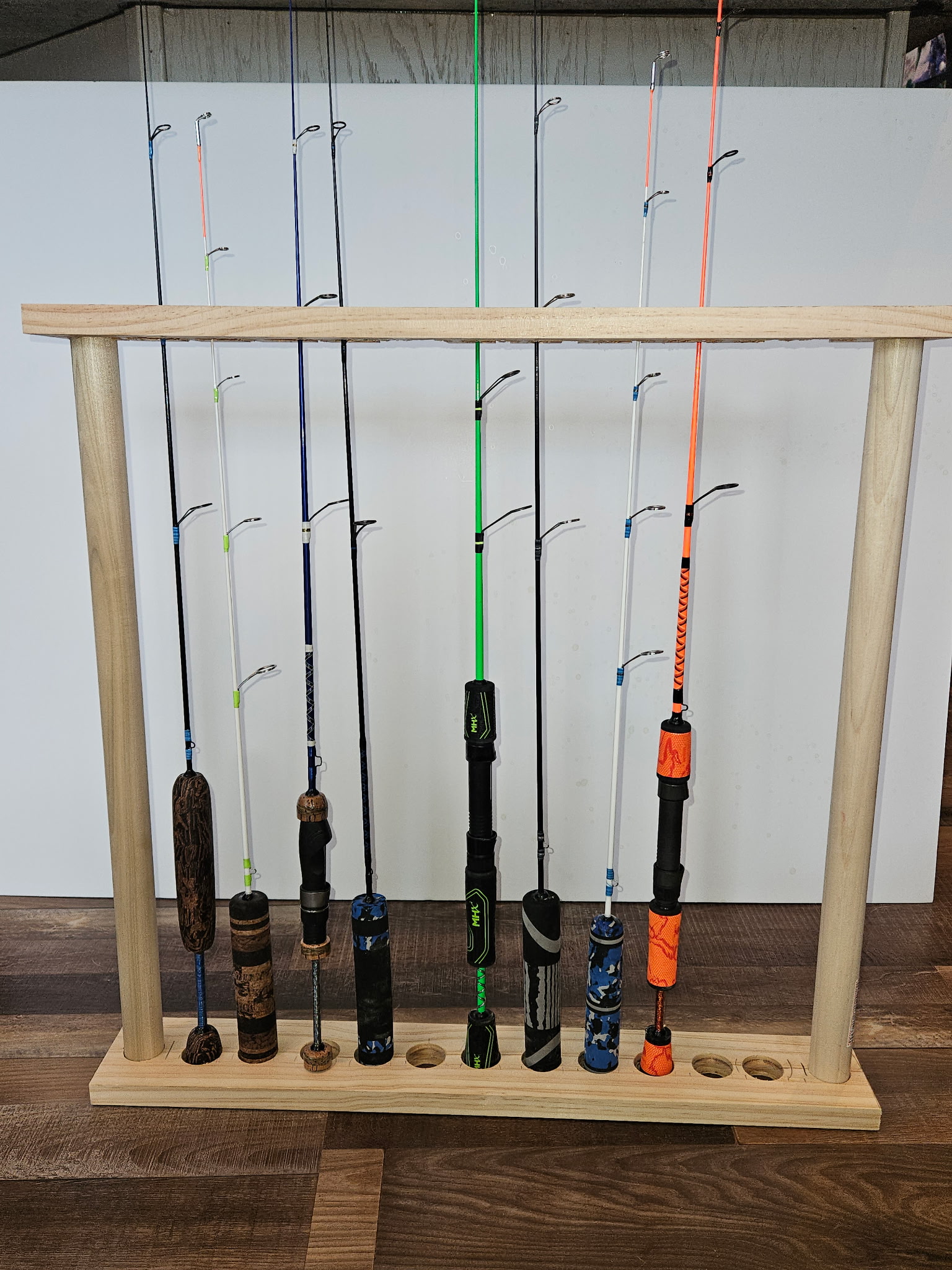 Close-up of a finished OBG custom rod blank with guide wraps and epoxy finish
