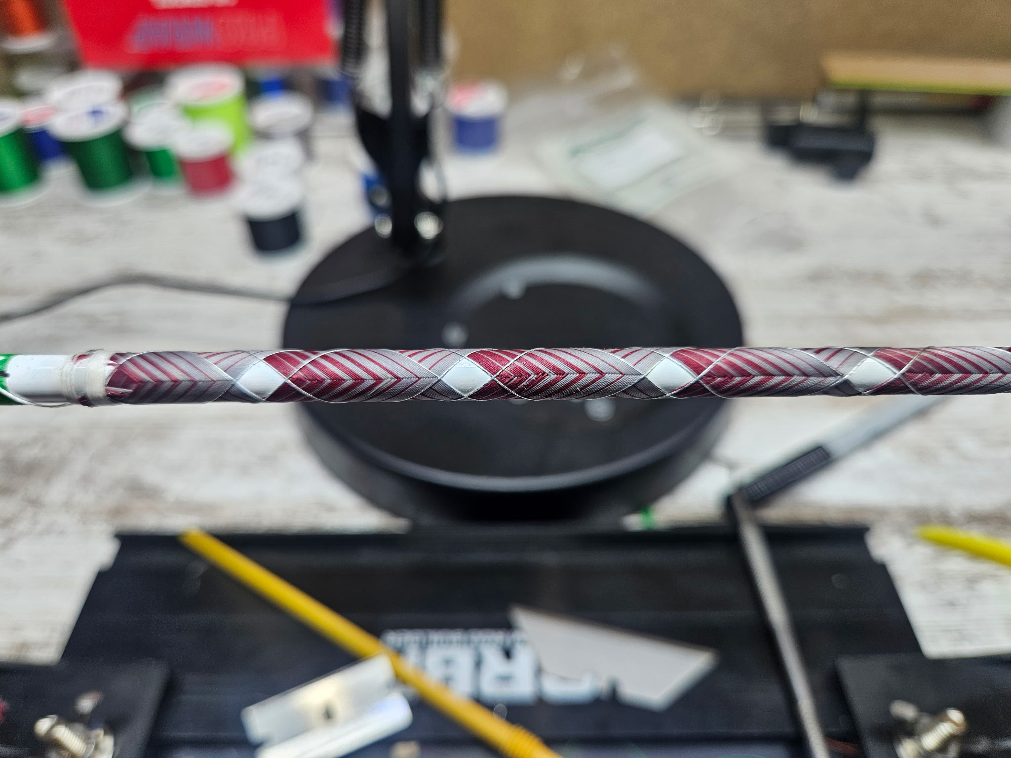 Custom rod blank detail showing smooth finish and thread color accent bands