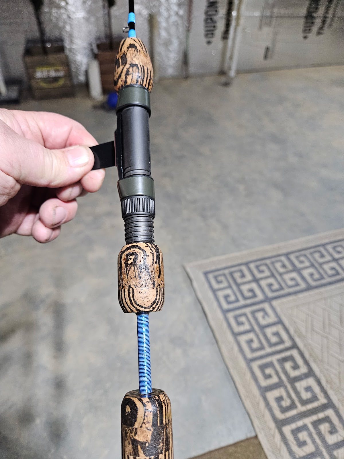 Completed OBG custom rod laid flat showing full-length build and guide spacing